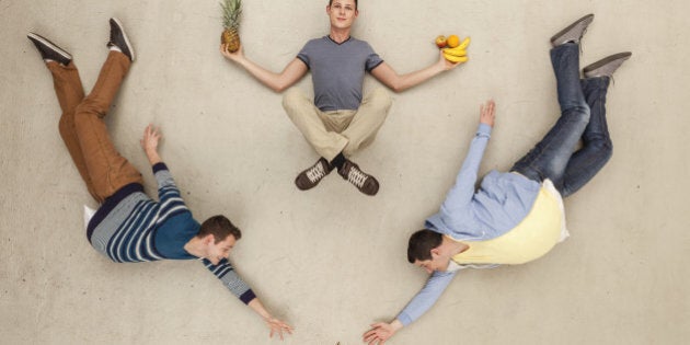 Men with food lying on floor