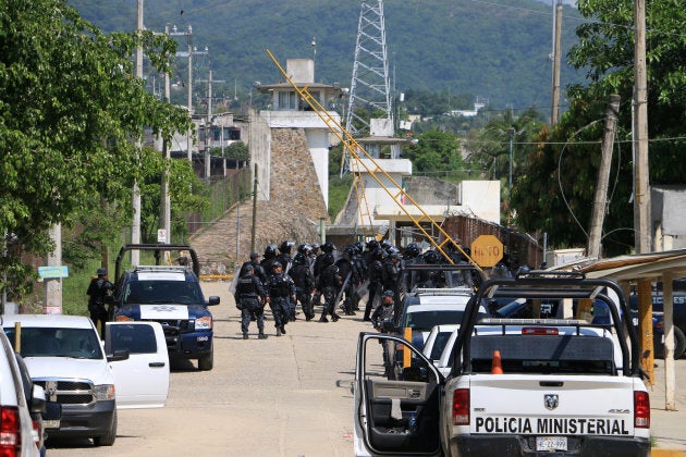 Riot police stormed the Las Cruces prison after the fighting broke out in the early hours of Thursday morning.