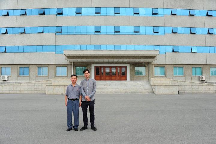 Alek and Mr Ri outside the building they took classes in.