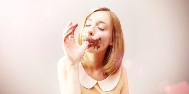 girl eating chocolate