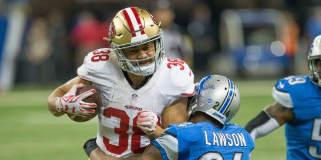 DETROIT, MI - DECEMBER 27: Jarryd Hayne #38 of the San Francisco 49ers tries to break a tackle from Nevin Lawson #24 of the Detroit Lions during an NFL game at Ford Field on December 27, 2015 in Detroit, Michigan. The Lions defeated the 49ers 32-17. (Photo by Dave Reginek/Getty Images)