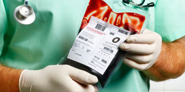 Doctor/ Nurse holding blood bag.