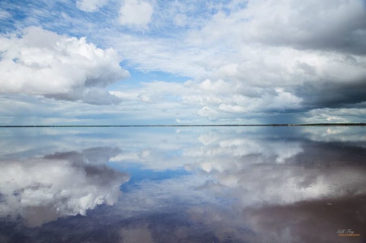 Gill only had minutes to snap a perfect sky mirror photo before the weather changed.