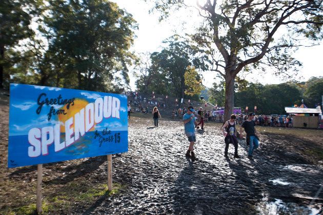 Festival goers make their way through the mud during Splendour in the Grass 2015