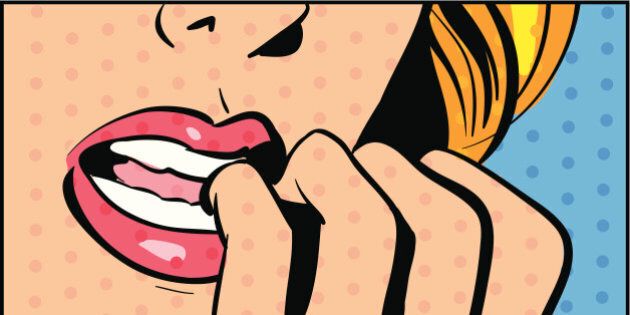 Woman biting fingernails