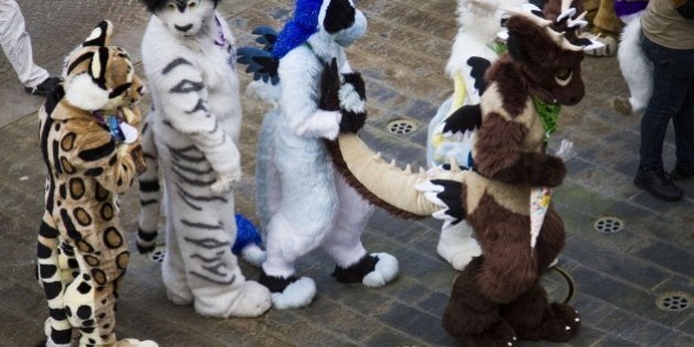 Delegates to the Eurofurence, 'Europe's biggest furry convention' dance at the conference hotel in Berlin on August 21, 2014. Fur friends attended the conference and the organisers describe themselves as 'a collection of artists, animators, writers, costumers, puppeteers, and just everyday fans who enjoy cartoon animals and their kind. Membership is open to any and all who like to imagine what it would be like if animals could walk and talk as we do' AFP PHOTO / ODD ANDERSEN (Photo credit should read ODD ANDERSEN/AFP/Getty Images)