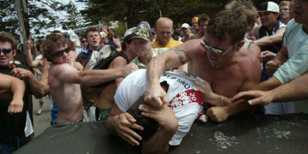 (AUSTRALIA & NEW ZEALAND OUT) Race riots. A mob beats and punches a man at North Cronulla. Hooligans yelling racial, insults targeted anyone they believed to be of Middle Eastern background, 11 December 2005. SMH Picture by ANDREW MEARES (Photo by Fairfax Media/Fairfax Media via Getty Images)