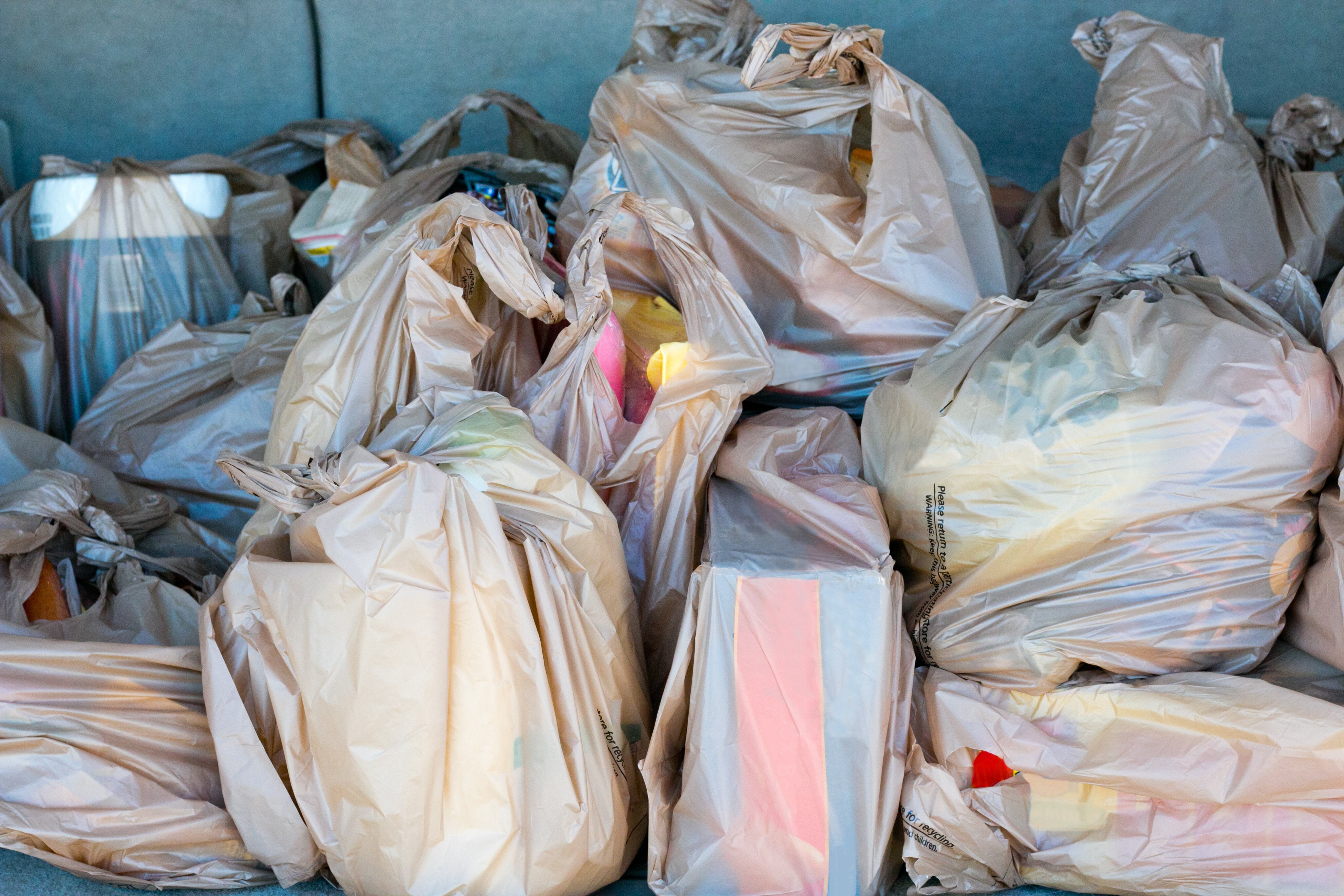 coles banning woolworths bags