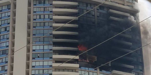 Joel Horiguchi, a resident of Marco Polo, took this photo of the building on fire about 4:50 p.m. local time.