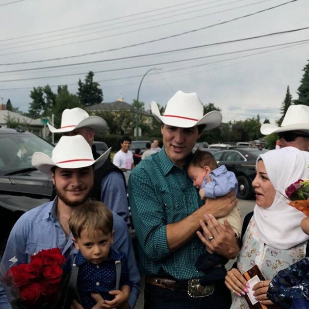 Prime Minister Justin Trudeau holds two-month-old Justin-Trudeau Adam Bilal in Calgary Saturday.