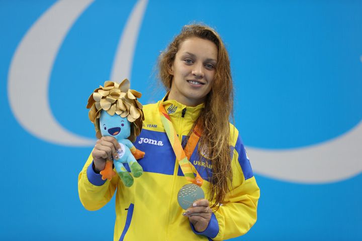 Kateryna Istomina wins yet another gold for Ukraine -- this one in the Women's 100m Butterfly S8. The little blue thing took the silver. OK not really, it's just a doll.