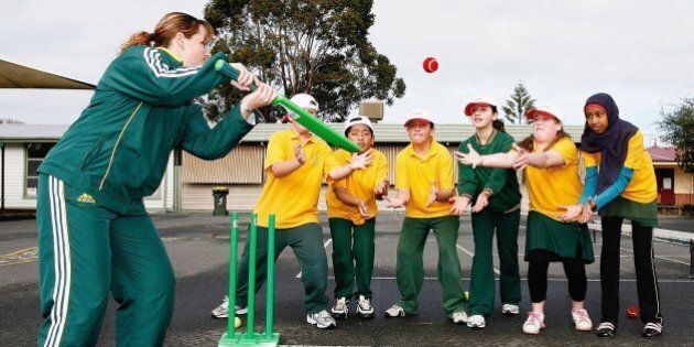 MELBOURNE, AUSTRALIA - AUGUST 01: Australian cricketer Karen Rolton plays cricket with students during the 1Seven Media Launch at Footscray West Primary School August 01, 2006 in Melbourne Australia. (Photo by Quinn Rooney/Getty Images)
