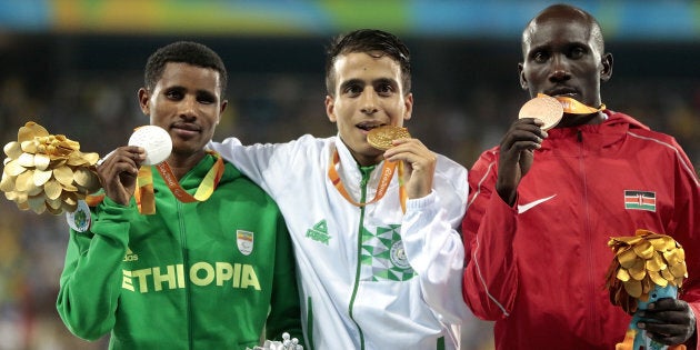 Abdellatif Baka of Algeria and Yeltsin Jacques of Brazil lead the pack in the men's 1500 meter T13 Final on Day 4 of the Rio 2016 Paralympic Games.