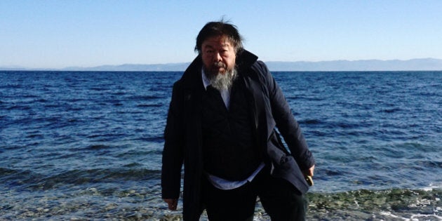 Chinese activist and artist Ai Weiwei walks on a beach near the town of Mytilene, on the Greek island of Lesbos on January 1, 2016.Chinese dissident artist Ai Weiwei paid on December 28, 2015 a holiday visit to refugees and migrants flocking to the Greek island of Lesbos, tweeting out photos and videos in appeals for their plight. / AFP / ANGELOS TZORTZINIS (Photo credit should read ANGELOS TZORTZINIS/AFP/Getty Images)