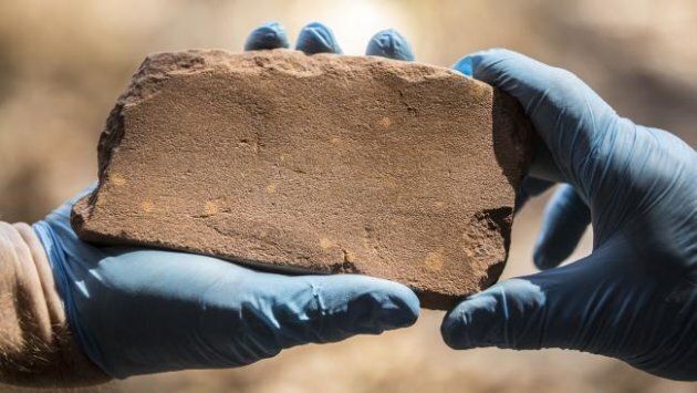An axe-sharpening stone found inside the Kakadu National Park is one of a trove of artefacts proving Aboriginal Australians have been here at least 65,000 years.