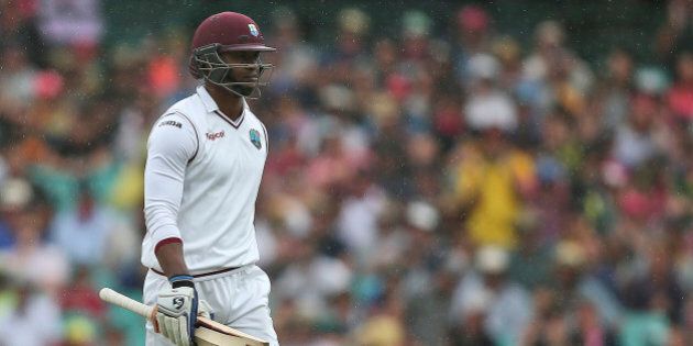 West Indies batsman Marlon Samuels walks off the field after he was run out during their cricket test match against Australia in Sydney Sunday, Jan. 3, 2016.(AP Photo/Rob Griffith)