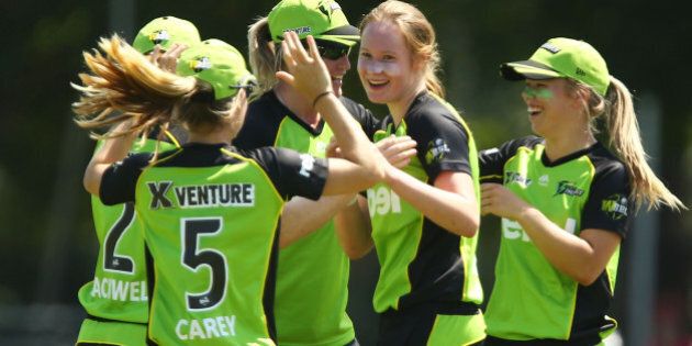 SYDNEY, AUSTRALIA - DECEMBER 06: Lauren Cheatle of the Thunder celebrates with team mates after taking the wicket of Sara McGlashan of the Sixers during the Women's Big Bash League match between the Sydney Thunder and the Sydney Sixers at Howell Oval on December 6, 2015 in Sydney, Australia. (Photo by Matt King - CA/Cricket Australia/Getty Images)