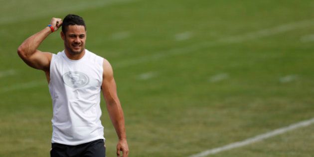 San Francisco 49ers' Jarryd Hayne walks across a practice field on his way to a news conference after facing the Denver Broncos in an NFL football scrimmage at the Broncos' headquarters Thursday, Aug. 27, 2015, in Englewood, Colo. (AP Photo/David Zalubowski)