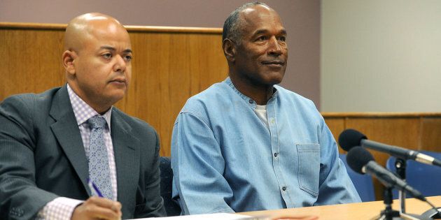 O.J. Simpson sits with his lawyer during his parole hearing on Thursday.
