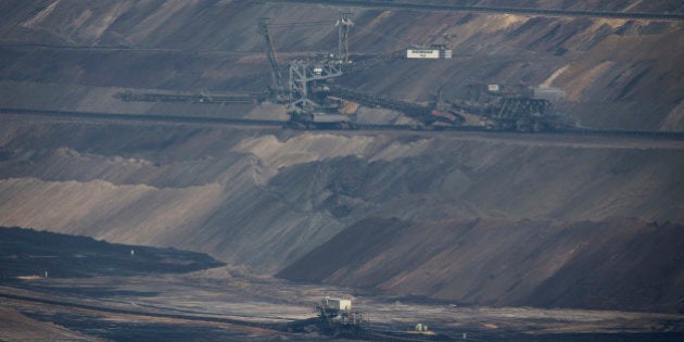 A giant excavator operates at an open pit lignite mine, also known as brown coal, operated by RWE AG in Hambach, Germany, on Monday 7, Sept. 2015. German utilities including RWE, unions and the states, successfully fended off a plan by Chancellor Angela Merkel's government this summer to fast-track lignite power plant closures to help Germany meet its climate goals. Photographer: Jasper Juinen/Bloomberg via Getty Images