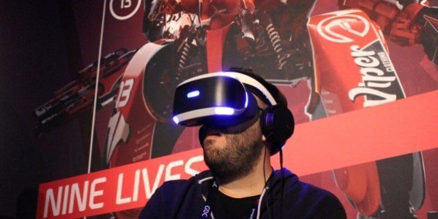 Nick Pino of TechRadar tries out a PlayStation VR video game at a Sony press event March 15, 2016 in San Francisco.Sony on March 15, 2016 said it plans to make virtual reality mainstream with the October release of PlayStation VR headgear priced at $399. / AFP / GLENN CHAPMAN (Photo credit should read GLENN CHAPMAN/AFP/Getty Images)