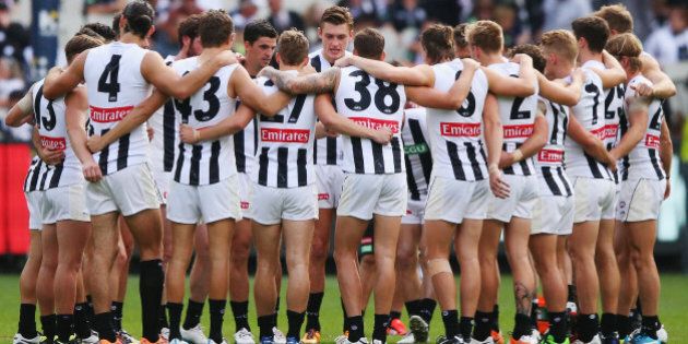 MELBOURNE, AUSTRALIA - APRIL 09: Magpies players huddle during the round three AFL match between the St Kilda Saints and the Collingwood Magpies at Melbourne Cricket Ground on April 9, 2016 in Melbourne, Australia. (Photo by Michael Dodge/Getty Images)