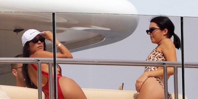 Kourtney Kardashian and Kendall Jenner in Cannes sporting the latest sunglass shape. Of course.