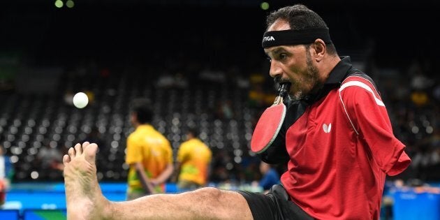Egypt's Ibrahim Hamadtou serves with his foot at
