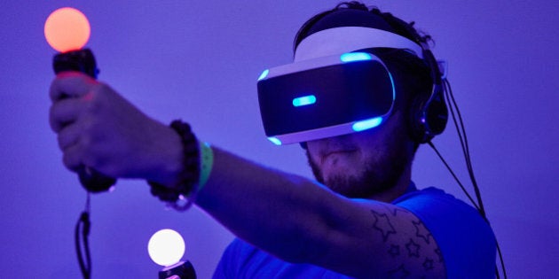 BIRMINGHAM, ENGLAND - SEPTEMBER 24: A gamer tests out Playstation VR (Virtual Reality) on the Sony PS4 on September 24, 2015 in Birmingham, England. The UK Gaming Industry contributed more than Â£1 billion to the UK's GDP in 2013 and estimates now put it's worth at nearer Â£1.72 billion. (Photo by M Bowles/Getty Images)