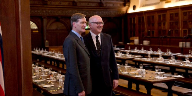 The Attorneys General Australia's George Brandis QC, right, and Britain's Dominic Grieve QC pose together for a photograph before an evening dinner in the Grand Hall of Gray's Inn in London, Wednesday, July 9, 2014. The Attorneys General from Australia, Britain, Canada, New Zealand and the U.S. are meeting in London for a conference July 9 to 11 to discuss emerging issues and existing trends in fighting international cybercrime. (AP Photo/Matt Dunham)