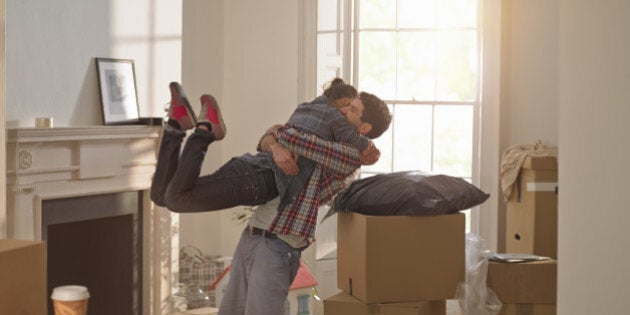 A couple celebrating moving in to a new home