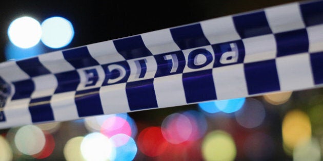 SYDNEY, AUSTRALIA - DECEMBER 16: Police tape is streched near the Lindt Chocolate Cafe in Martin Place following a hostage standoff on December 16, 2014 in Sydney, Australia. Two were reported dead after police stormed the Sydney cafe after a gunman had been holding hostages for 16 hours. (Photo by Joosep Martinson/Getty Images)