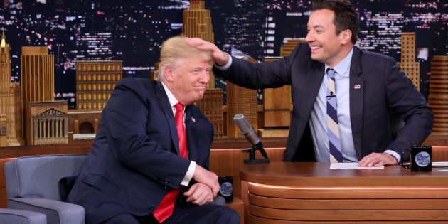 Republican Presidential Nominee Donald Trump gets a head rub during an interview with Jimmy Fallon on Sept. 15, 2016.