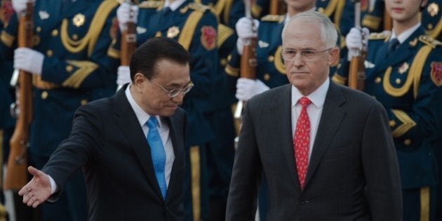 Australian Prime Minister Malcolm Turnbull (R) reviews a military honour guard with Chinese Premier Li Keqiang (L) during a welcome ceremony at the Great Hall of the People in Beijing on April 14, 2016. Turnbull is on a state visit to China. / AFP / NICOLAS ASFOURI (Photo credit should read NICOLAS ASFOURI/AFP/Getty Images)