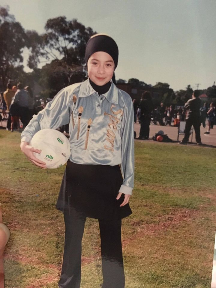 Zeynab Alshelh playing netball at 11 in a 'hijood' designed by the woman who would one day create the burquini.