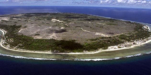 NAURU, NAURU: The barren and bankrupt island state of the Republic of Nauru awaits the arrival of 521 mainly Afghan refugees, 11 September 2001 which have been refused entry into Australia. The 25 square kilometres of land which is Nauru, has been devastated by phosphate mining which once made the Micronesian Nauruans the second wealthiest people per capita on earth. AFP PHOTO/Torsten BLACKWOOD (Photo credit should read TORSTEN BLACKWOOD/AFP/Getty Images)