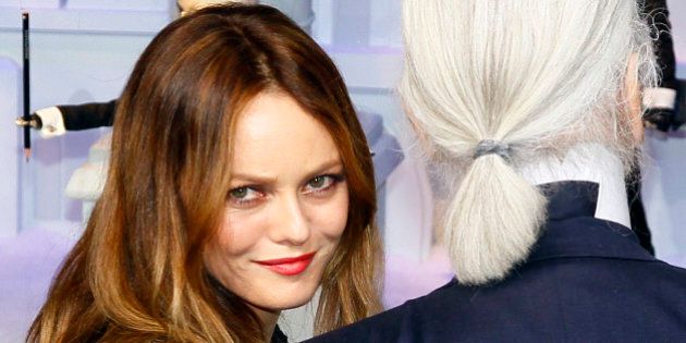 French actress and singer Vanessa Paradis, left, and fashion designer Karl Lagerfeld pose front of a Parisian department store unveiling its festive decorations in Paris, Wednesday, Nov. 9, 2011. (AP Photo/Francois Mori)