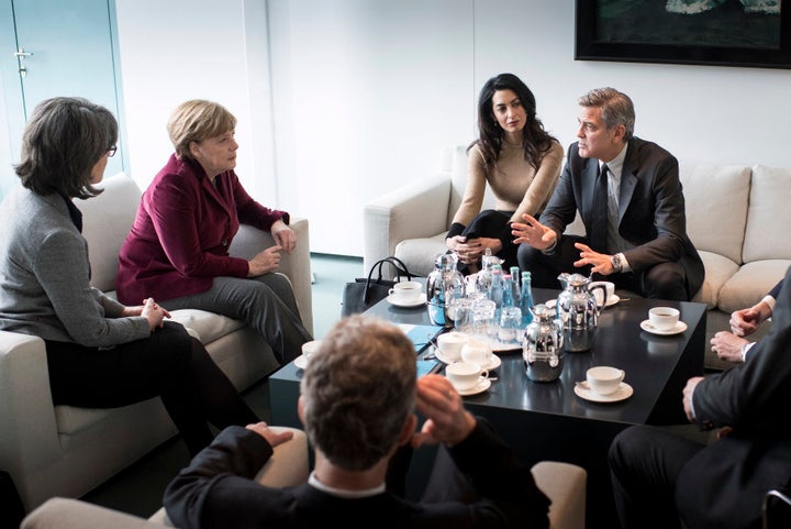 German Chancellor Angela Merkel meets with George Clooney and Amal Clooney at the Federal Chancellery to talk about refugee policy on February 12, 2016 in Berlin, Germany