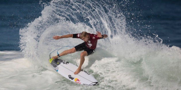 Hawaiian surfer Mick Fanning competes in the 2015 Oi Rio Pro World Surf League competition at Barra da Tijuca beach in Rio de Janeiro, Brazil, Tuesday, May 12, 2015. (AP Photo/Leo Correa)