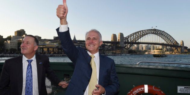 Australian Prime Minister Malcolm Turnbull, right, and New Zealand Prime Minister John Key travel on a ferry on Sydney Harbour with a backdrop of the Sydney Harbour Bridge in Sydney, Friday, Feb. 19, 2016. Turnbull and Key are traveling to Turnbull's home. (AP Photo/Dean Lewins, Pool)