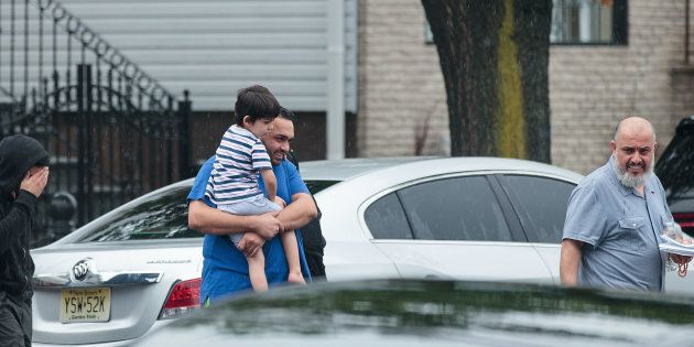 Mohammad Rahami leaves the family's fried chicken restaurant in Elizabeth, New Jersey, Monday. Rahami told reporters Tuesday he'd previously called law enforcement officials over concerns about his son.