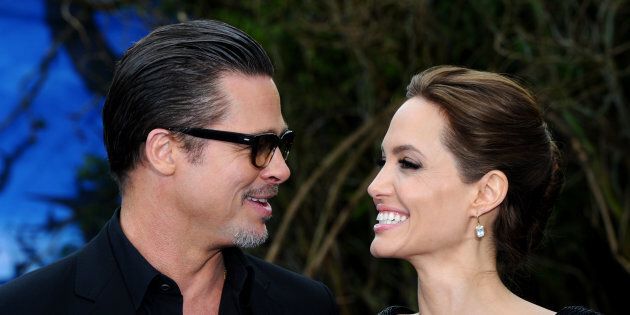 Brad Pitt and Angelina Jolie attend a private reception as costumes and props from Disney's 'Maleficent' are exhibited in support of Great Ormond Street Hospital at Kensington Palace on May 8, 2014 in London, England.