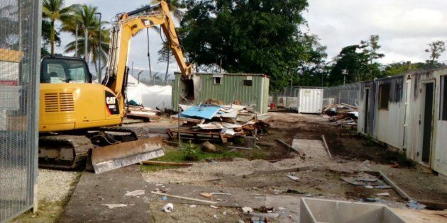 The Manus Island centre, in the early stages of demolition