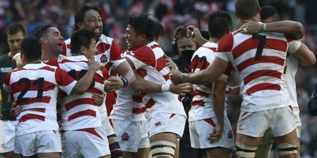 Japan's players celebrate winning the Pool B match of the 2015 Rugby World Cup between South Africa and Japan at the Brighton community stadium in Brighton, south east England on September 19, 2015. Japan won 34-32. AFP PHOTO / JUSTIN TALLISRESTRICTED TO EDITORIAL USE, NO USE IN LIVE MATCH TRACKING SERVICES, TO BE USED AS NON-SEQUENTIAL STILLS (Photo credit should read JUSTIN TALLIS/AFP/Getty Images)