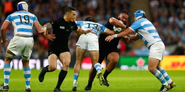 LONDON, ENGLAND - SEPTEMBER 20: Charlie Faumuina of the New Zealand All Blacksis tackled by Marcelo Bosch of Argentina and Lucas Noguera of Argentina during the 2015 Rugby World Cup Pool C match between New Zealand and Argentina at Wembley Stadium on September 20, 2015 in London, United Kingdom. (Photo by Phil Walter/Getty Images)