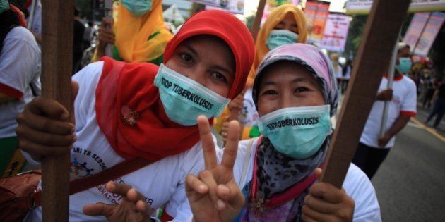 SURAKARTA, INDONESIA - MARCH 22: Activists hold banners during a rally marking the World Tuberculosis Day on March 22, 2015 in Surakarta, Indonesia. Tuberculosis is an infectious disease caused by the Mycobacterium tuberculosis. It is the second most deadly disease in the world after HIV / AIDS. These bacterias spread through water particles in the air that move because of cough, sneeze, or spit. PHOTOGRAPH BY Solo Imaji / Barcroft Media (Photo credit should read Solo Imaji / Barcroft Media via Getty Images)