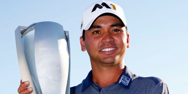 LAKE FOREST, IL - SEPTEMBER 20: Jason Day of Australia celebrates with the winner's trophy after the Final Round of the BMW Championship at Conway Farms Golf Club on September 20, 2015 in Lake Forest, Illinois. (Photo by Jamie Squire/Getty Images)