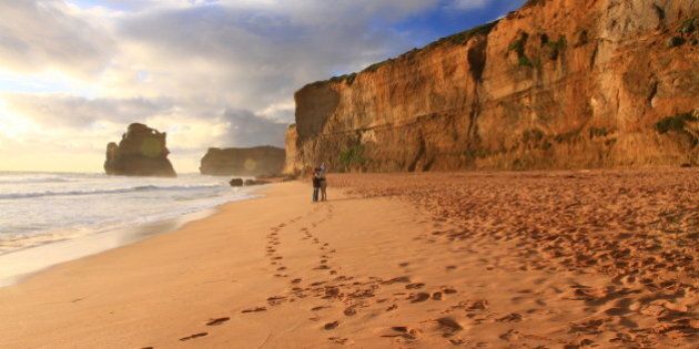[UNVERIFIED CONTENT] took in Great Ocean Road, a couple are taking photo in the beach near sunset time.
