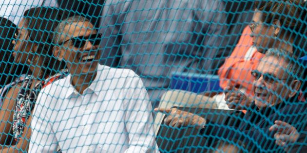 Cuban President Raul Castro, right, and U.S. President Barack Obama attend a baseball match between the Tampa Bay Rays and the Cuban national baseball team in Havana, Cuba, Tuesday, March 22, 2016. The crowd roared as Obama and Cuban President Raul Castro entered the stadium and walked toward their seats in the VIP section behind home plate. It's the first game featuring an MLB team in Cuba since the Baltimore Orioles played in the country in 1999. (Ismael Francisco/Cubadebate via AP)