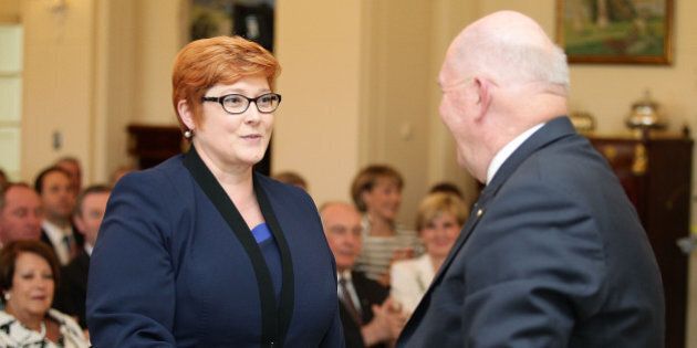 CANBERRA, AUSTRALIA - SEPTEMBER 21: Minister for Defence Marise Payne is congratulated by Governor-General Sir Peter Cosgrove during the swearing-in ceremony of the new Turnbull Government at Government House on September 21, 2015 in Canberra, Australia. Prime Minister Malcolm Turnbull announced a new look front bench on Sunday. (Photo by Stefan Postles/Getty Images)